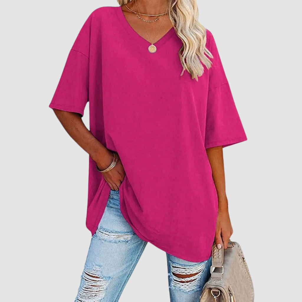 Pink V-neck t-shirt with short sleeves, loose drape and side-tuck detail.