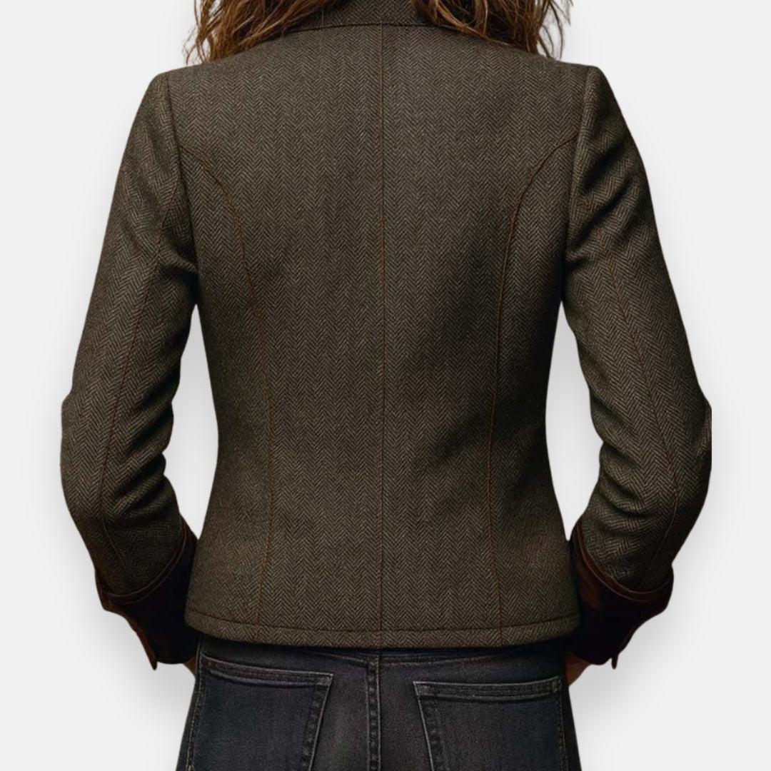 Olive herringbone jacket back view with seam detailing and dark inner cuffs
