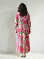 Pink floral midi dress, back view, three-quarter sleeves
