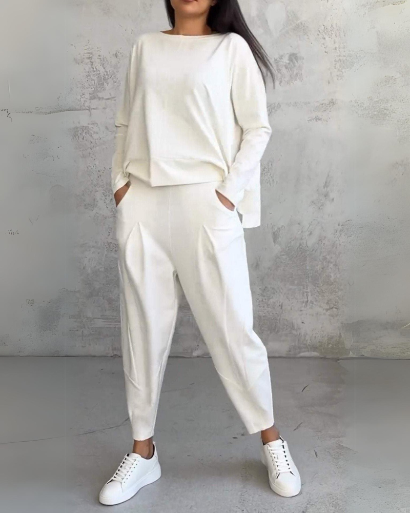 White two-piece lounge set, long-sleeve crewneck top and relaxed jogger pants