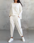 White two-piece lounge set, long-sleeve crewneck top and relaxed jogger pants
