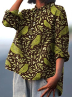 Women's bird-and-floral print button-up shirt with long sleeves and collar