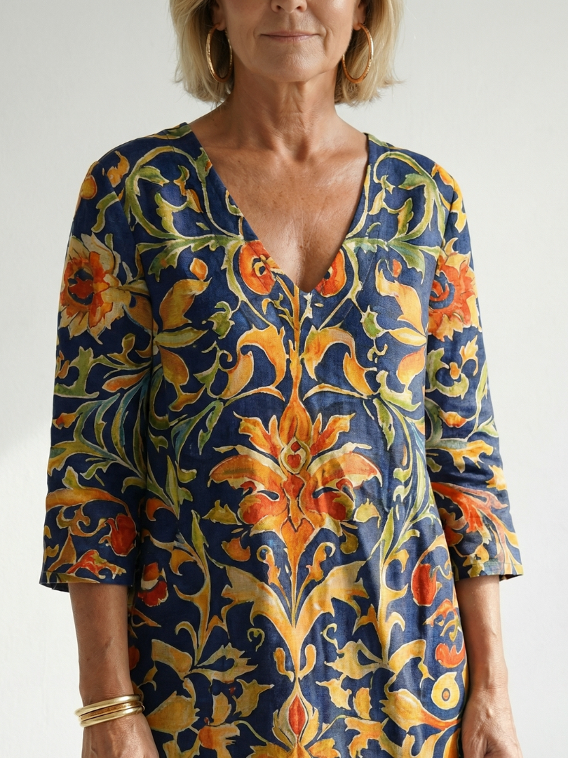 Elise floral midi dress close-up, V-neck with blue and orange ornate print