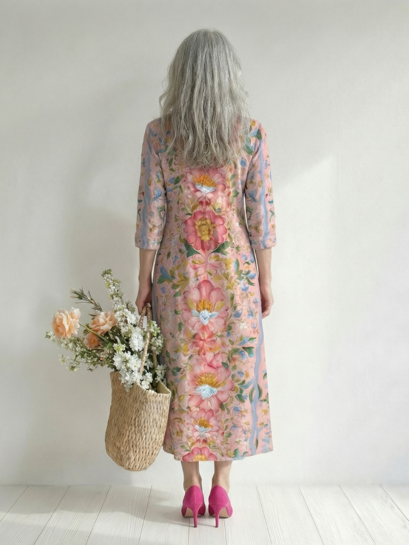 Back view of floral midi dress with 3/4 sleeves, soft pink with multicolor blooms