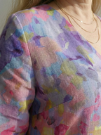 Multicolor abstract floral fabric detail on midi dress, V-neck area