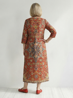 Back view of red patchwork midi dress with 3/4 sleeves