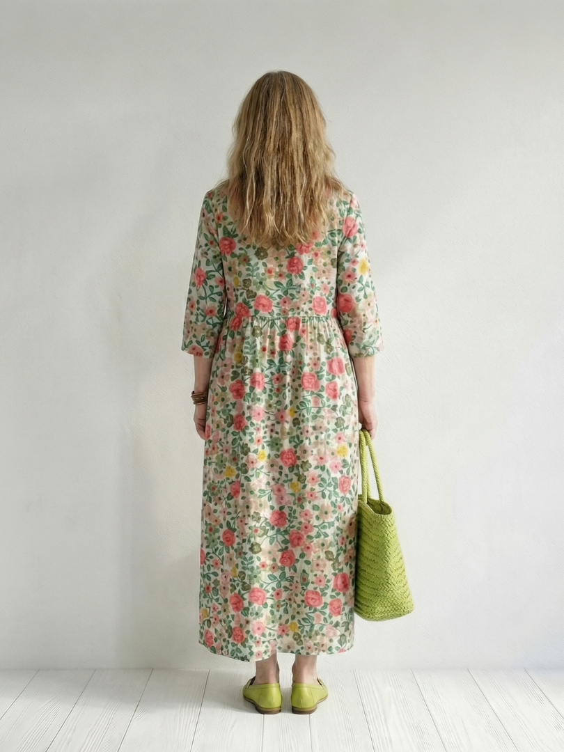 Floral scatter midi dress, back view, three-quarter sleeves and gathered skirt
