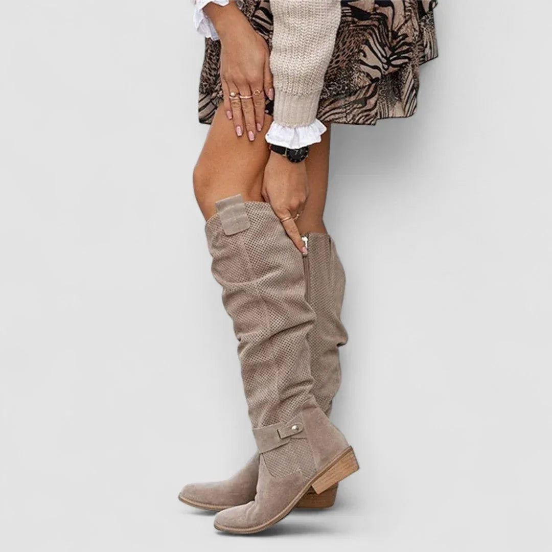 Beige orthopedic western boots with tall shaft, side zipper, and double snap ankle straps.
