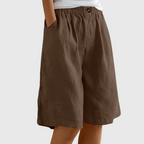 Loose-fit elastic waist shorts in brown with button detail at waistband