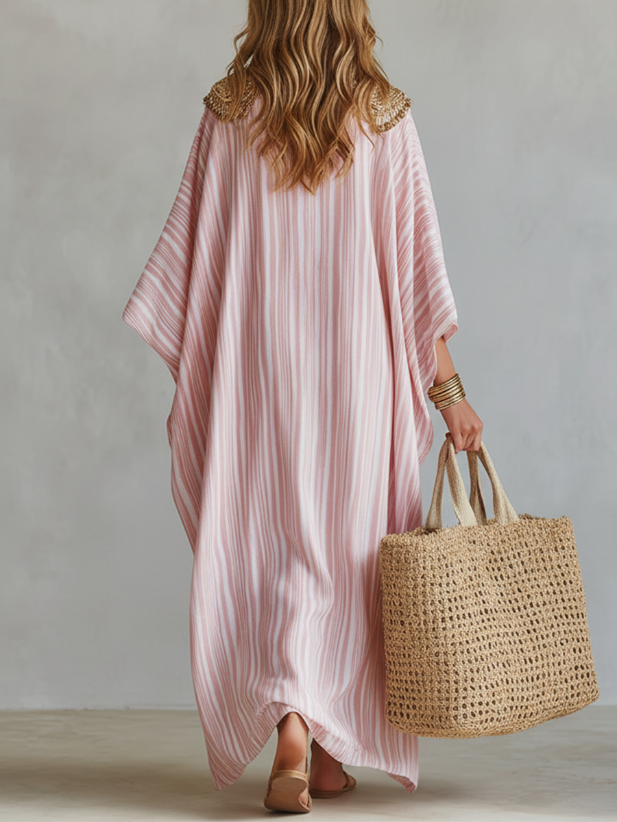 Soft pink striped kaftan dress with loose silhouette and wide draped sleeves, back view