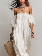Ivory off-shoulder pleated maxi dress with decorative neckline and draped sleeves