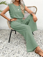 Emerald green lace-trim sleeveless top with matching wide-leg pants, tied waist