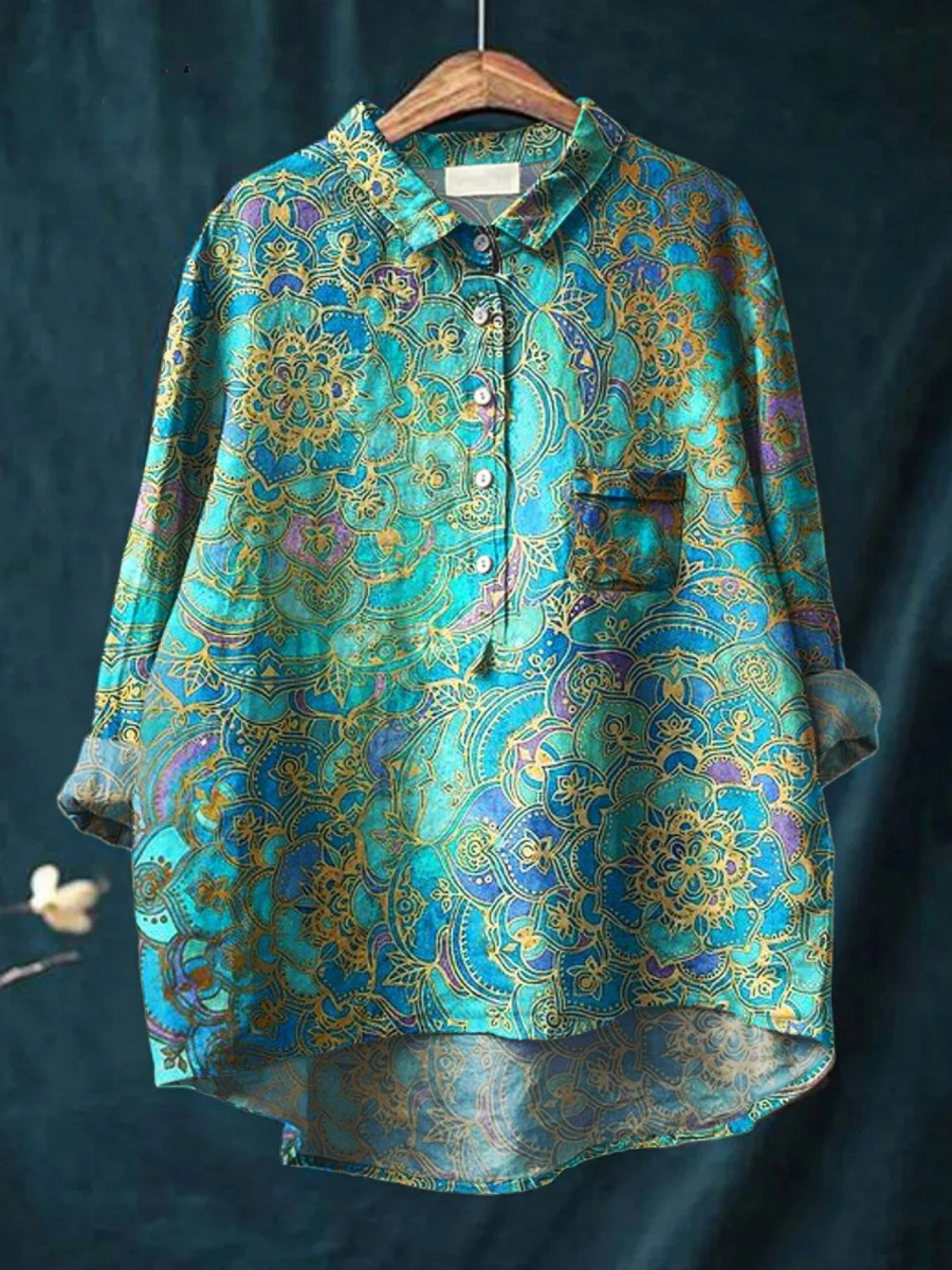 Women’s casual button-up shirt with vibrant retro art print in teal, gold, and purple