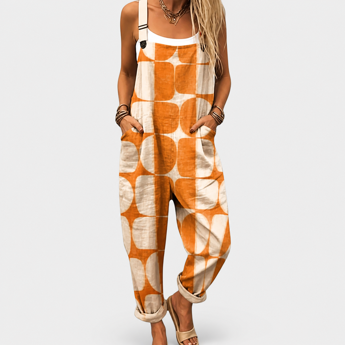 Orange and white printed sleeveless jumpsuit with wide legs and front pockets