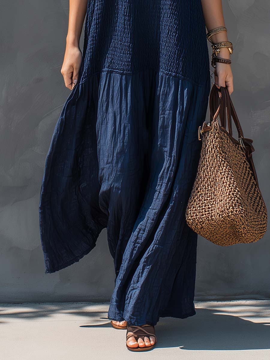 Navy blue tiered maxi dress with flowing drape