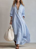 Blue and white striped maxi shirtdress with V-neck and button front, tiered skirt