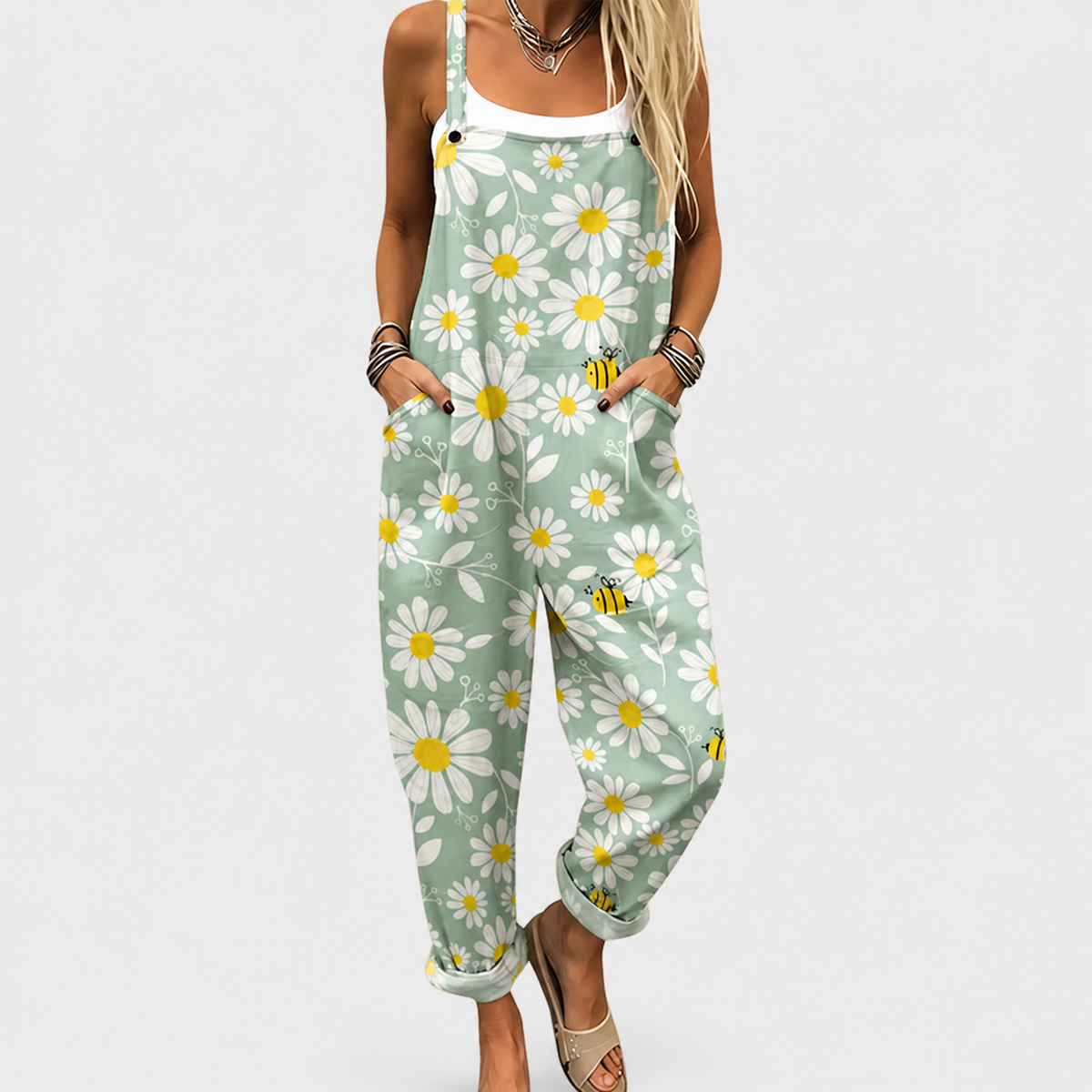 Mint green daisy-print overalls with adjustable straps and front pocket