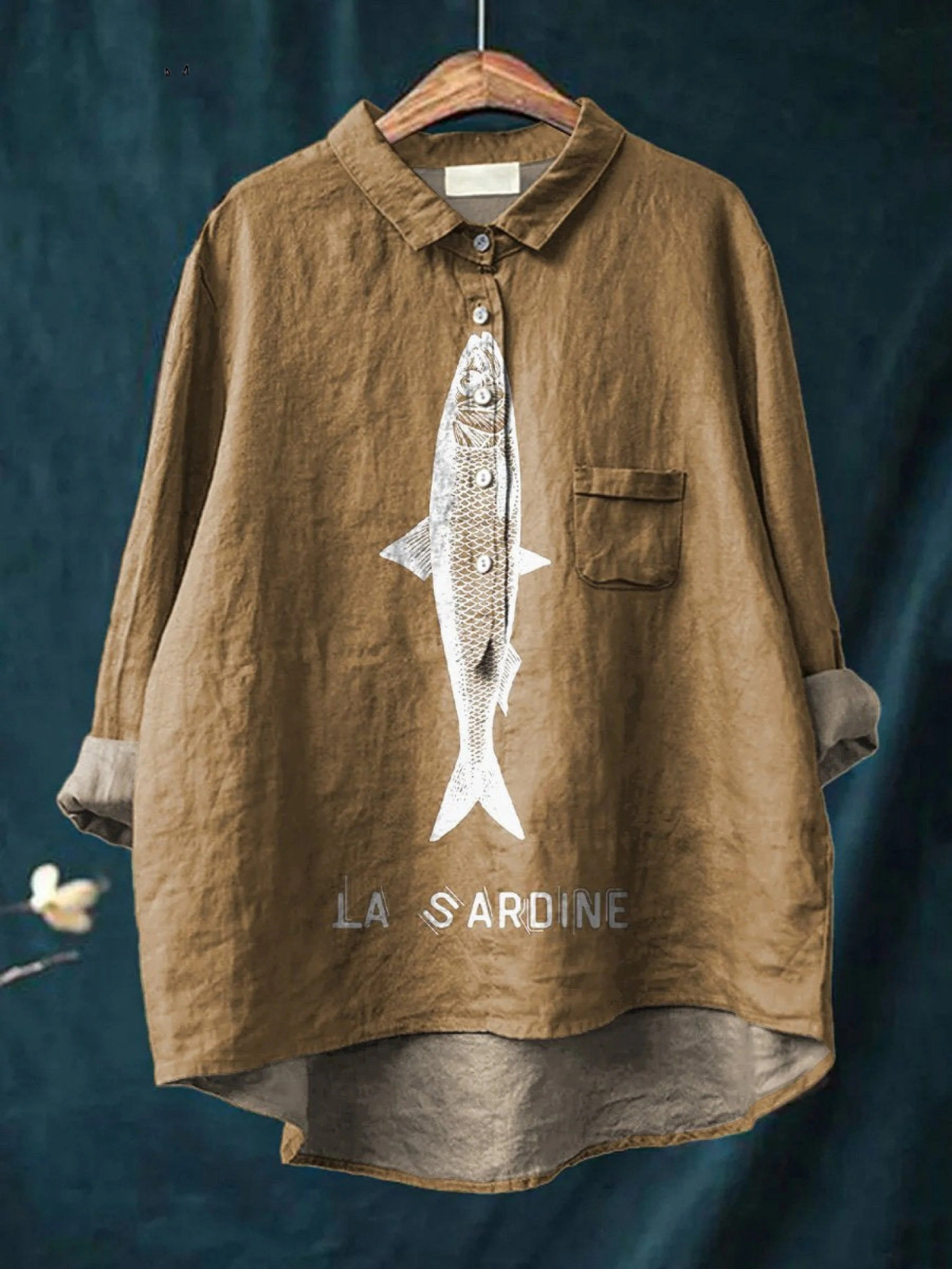 Brown women's casual button-up shirt with sardine graphic and chest pocket.