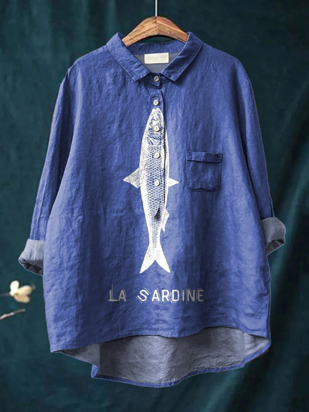 Blue women's casual button-up shirt with sardine graphic and chest pocket.