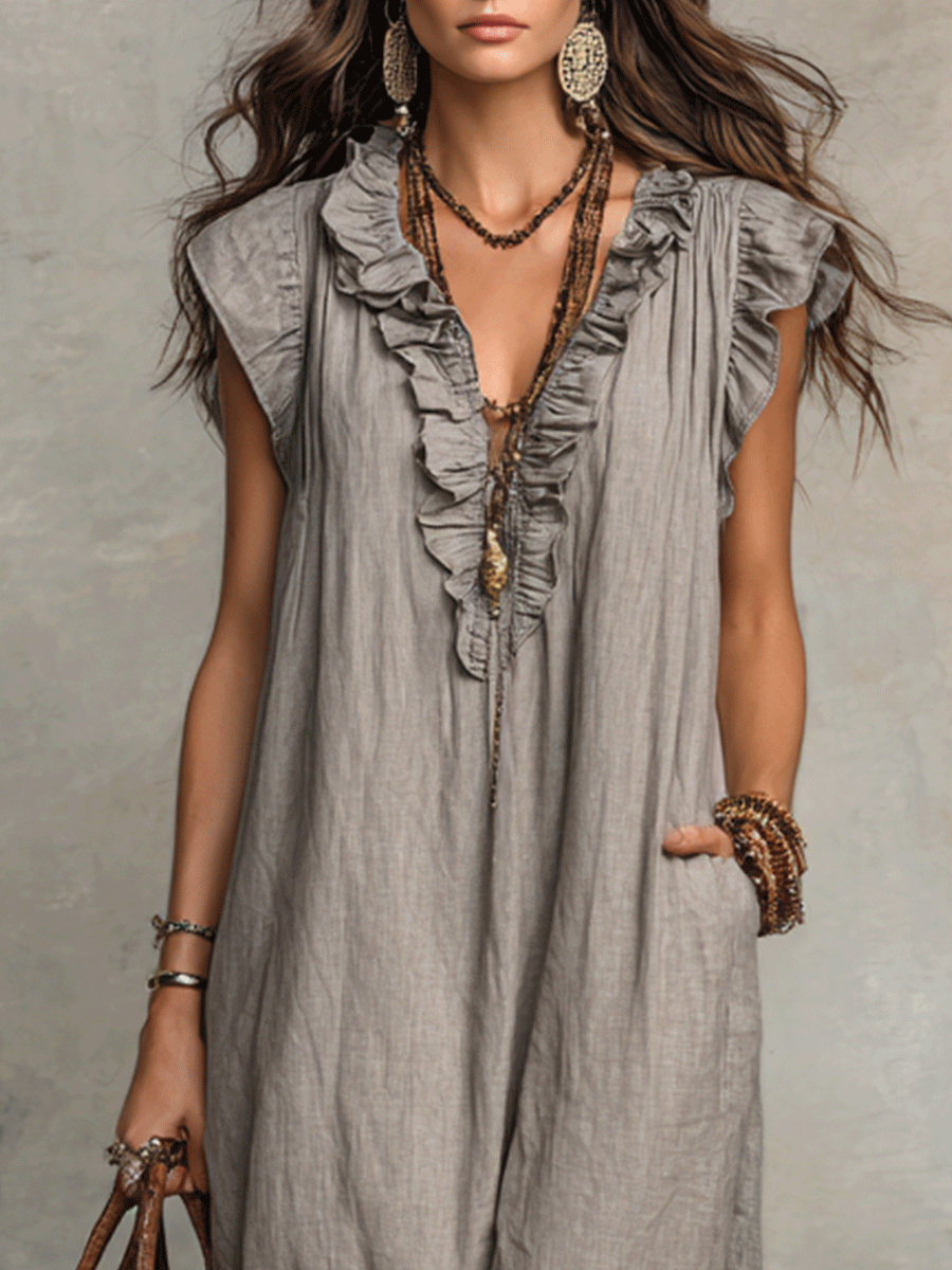 Grey sleeveless maxi dress with layered ruffle V-neck and vertical button placket.