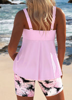Light pink cross-body tankini back view with adjustable straps and pink patterned shorts