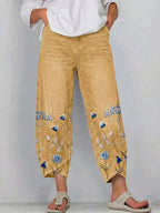 Yellow casual trousers with blue-and-white floral embroidery panels on the sides