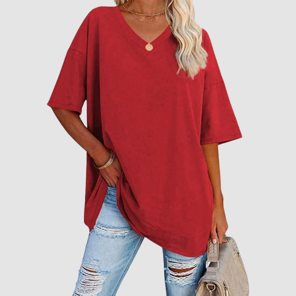 Red V-neck t-shirt with short sleeves, loose drape and side-tuck detail.