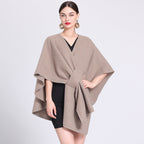 Taupe caped fleece shawl with V-neck and tied waist, wide cape sleeves.