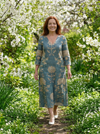 Floral midi dress in teal with gold V-neck and three-quarter sleeves, relaxed A-line