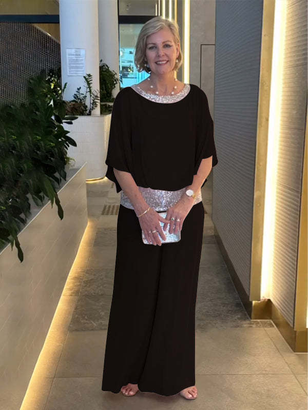 Black 2-piece set with draped top, wide-leg pants, and silver sequin waist belt