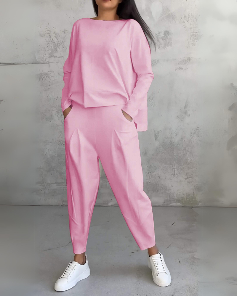 Pink two-piece lounge set, long-sleeve crewneck top and relaxed jogger pants