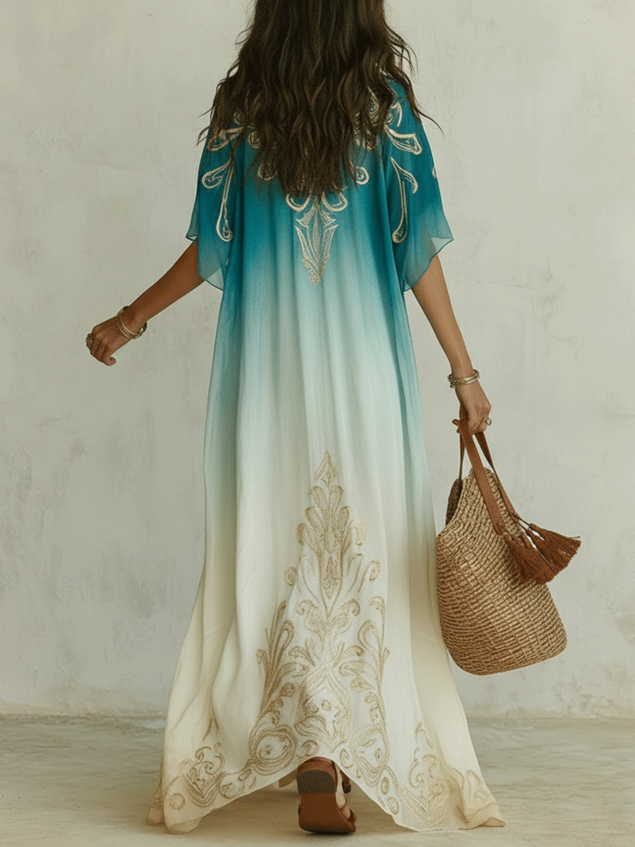 Back view of aqua ombre kaftan maxi dress with flowing long hem and gold swirl embroidery