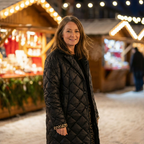 Black quilted long coat with high collar and front zip