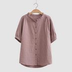 Lightweight cotton shirt in dusty mauve, short sleeves, button front, ruffled crew neck.
