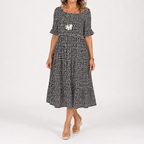 Black and white dotted short-sleeve midi dress with scoop neck and flared skirt