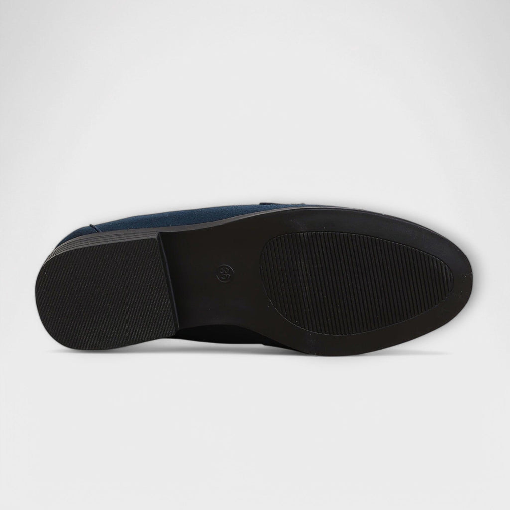 Navy suede loafer outsole view with textured traction and sidewall edge