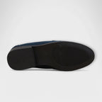 Navy suede loafer outsole view with textured traction and sidewall edge