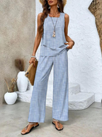 Blue pinstripe two-piece set with sleeveless layered top and wide-leg pants