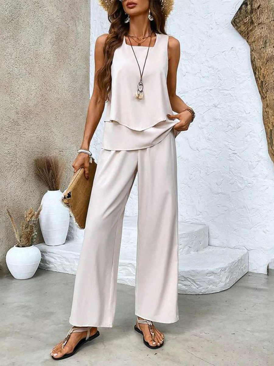 White sleeveless layered top and wide-leg pants two-piece set