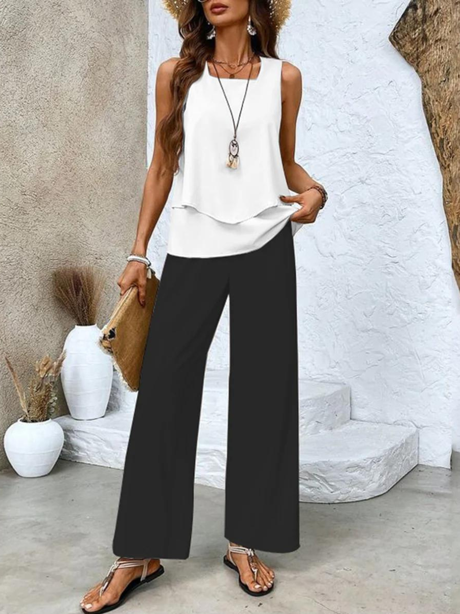 White sleeveless layered top with black wide-leg pants two-piece set