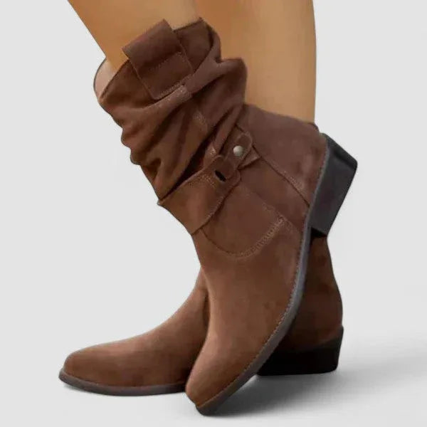 Brown suede western boots with side zipper and buckle strap across top, block heel