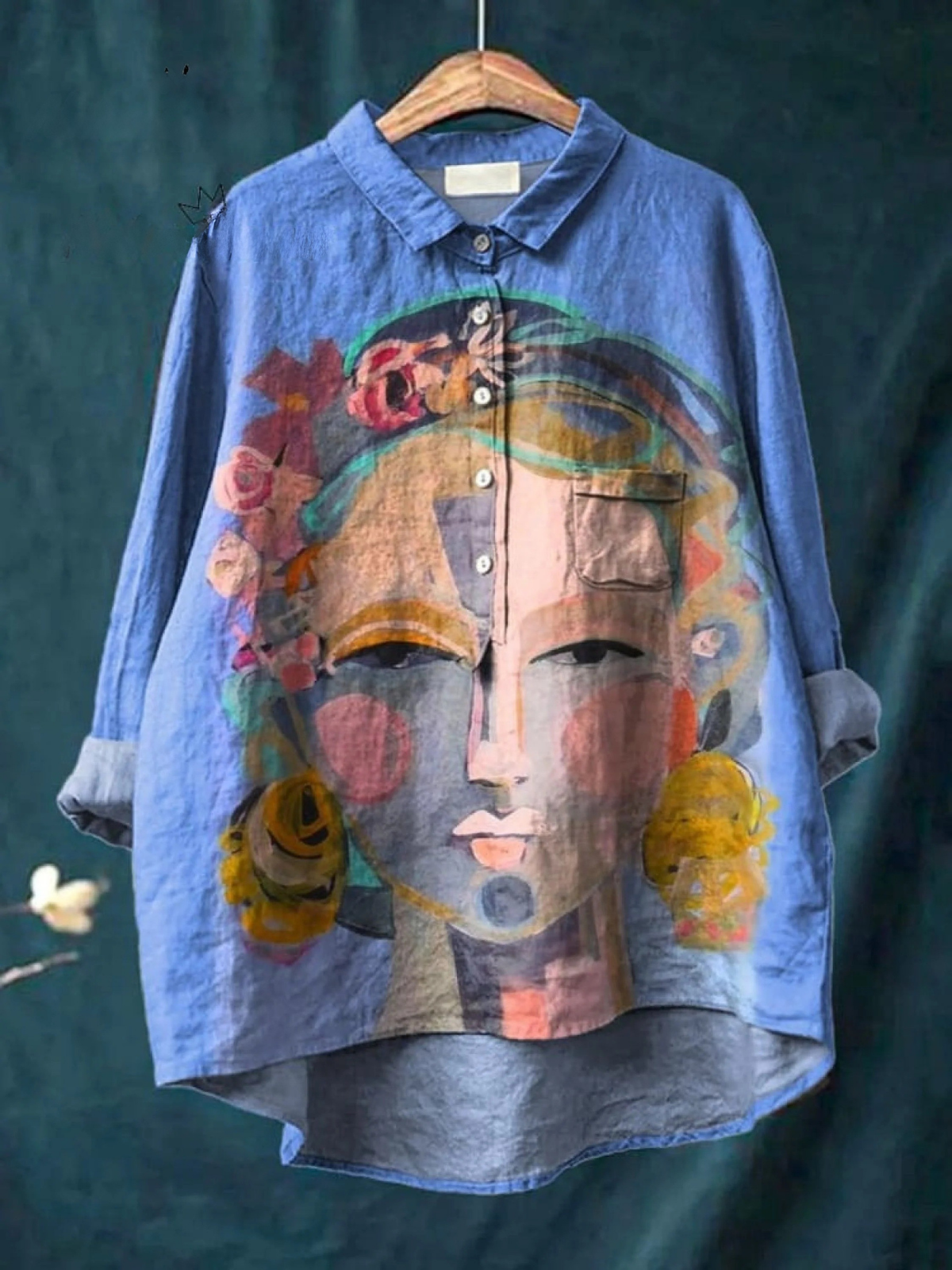 Women's casual button-up shirt in blue with colorful portrait art print