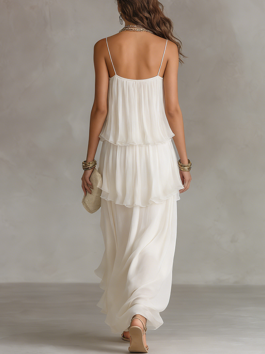 White sheer maxi dress, tiered back view with spaghetti straps and ruffled layers