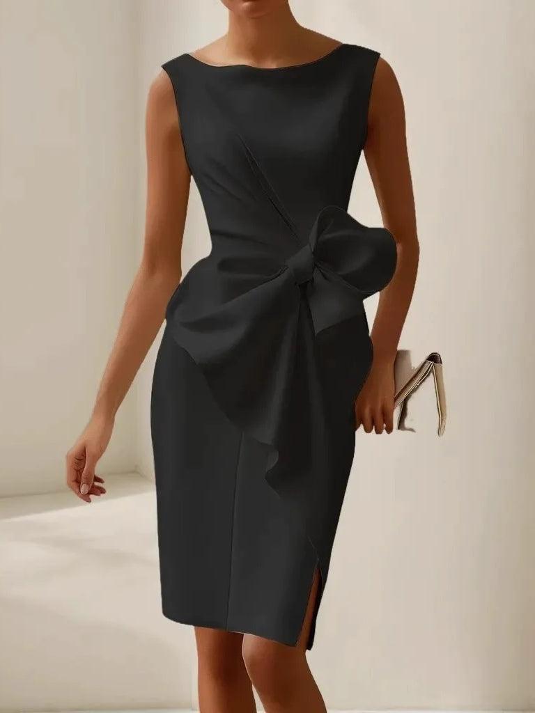 Black satin sleeveless bow-tie sheath dress with large bow at waist and slit