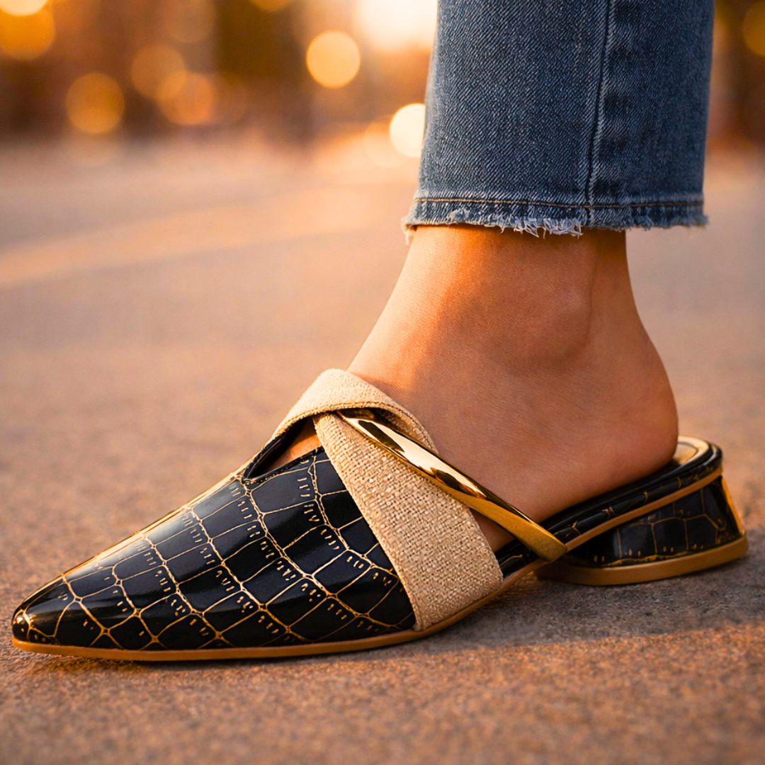 Black gator-pattern slip-on shoe with beige fabric strap and gold accent block heel