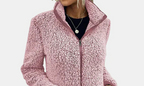 Pink teddy jacket close-up with full-zip front, stand collar, and textured fleece.