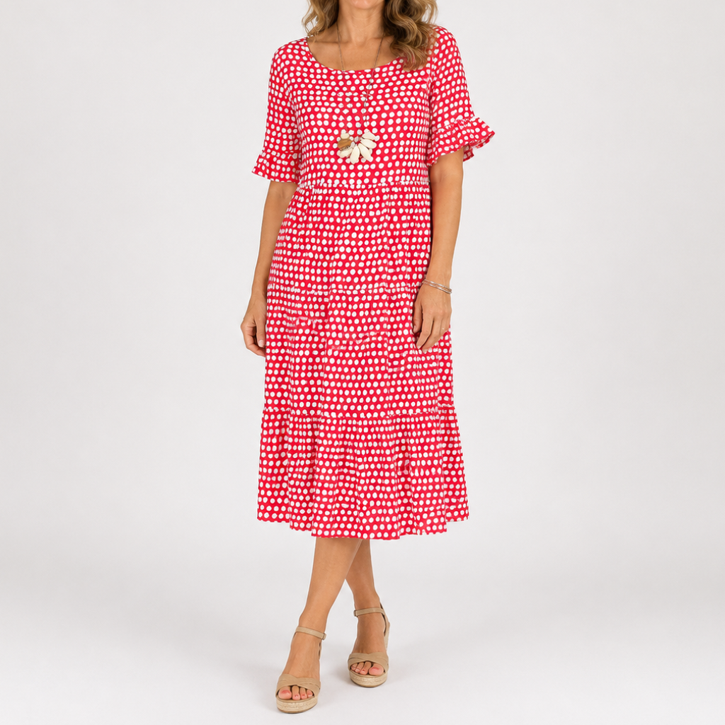 Short-sleeve red polka dot midi dress with scoop neck and floral brooch