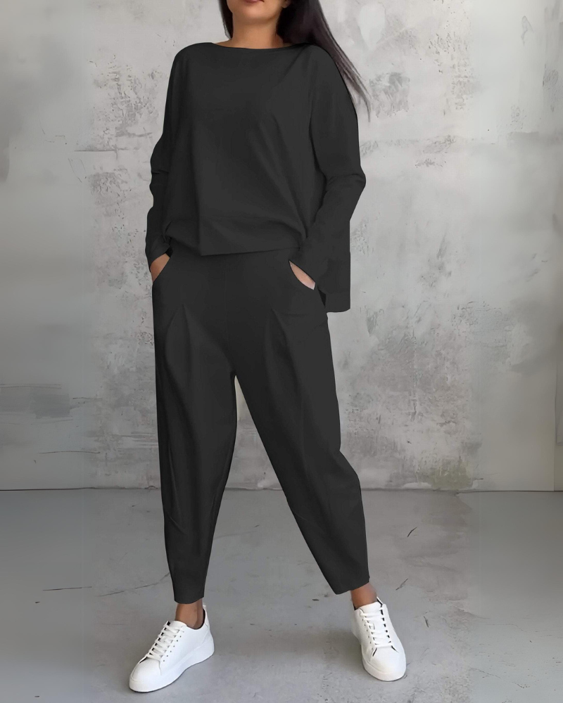 Black two-piece lounge set, long-sleeve crewneck top and relaxed jogger pants