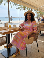 Pink multicolor striped midi dress with V-neck and loose fit