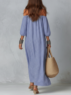 Back view: blue and white striped off-shoulder loose resort dress, billowy 3/4 sleeves